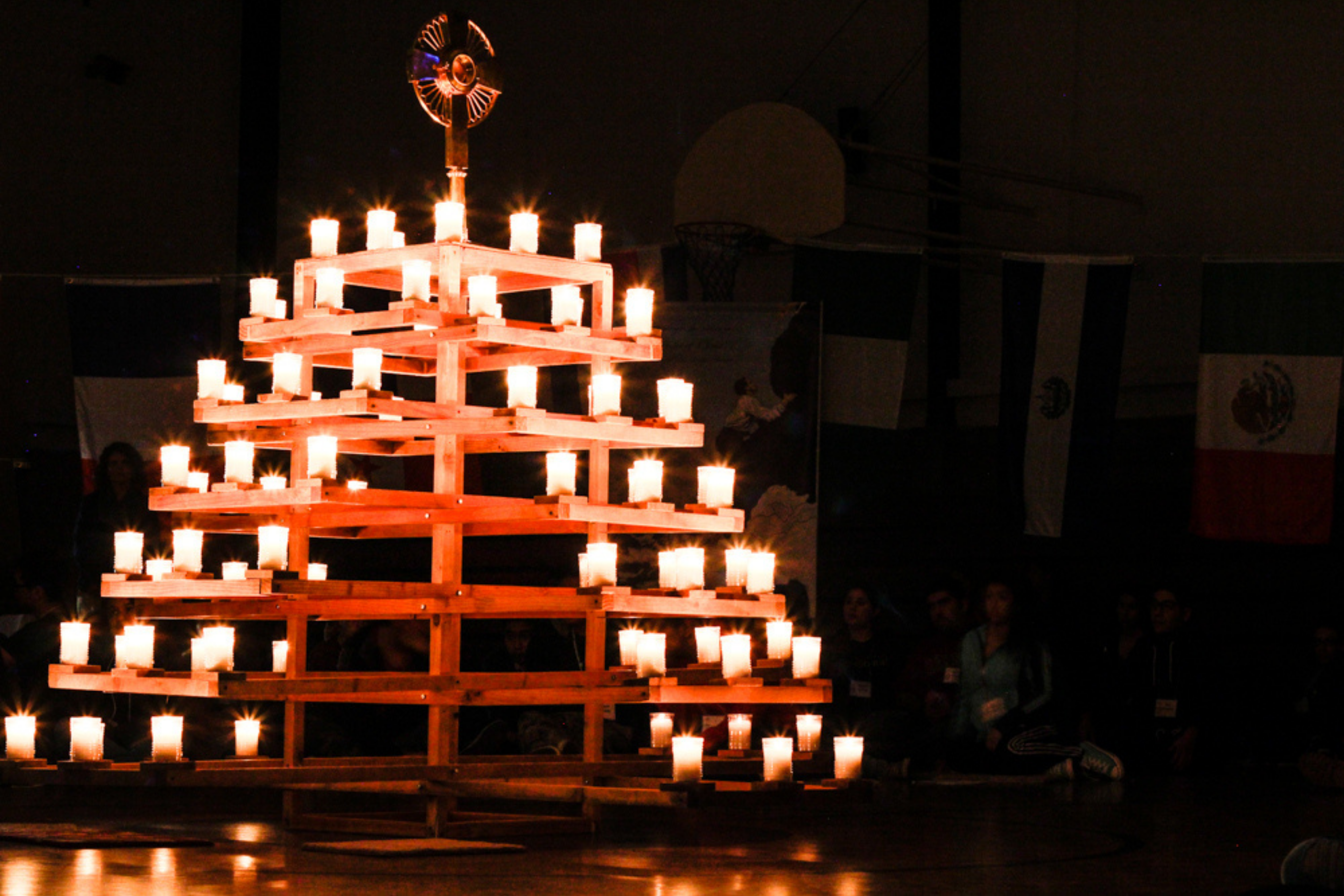 The Eucharist exposed atop a "Burning Bush" of lit candles.